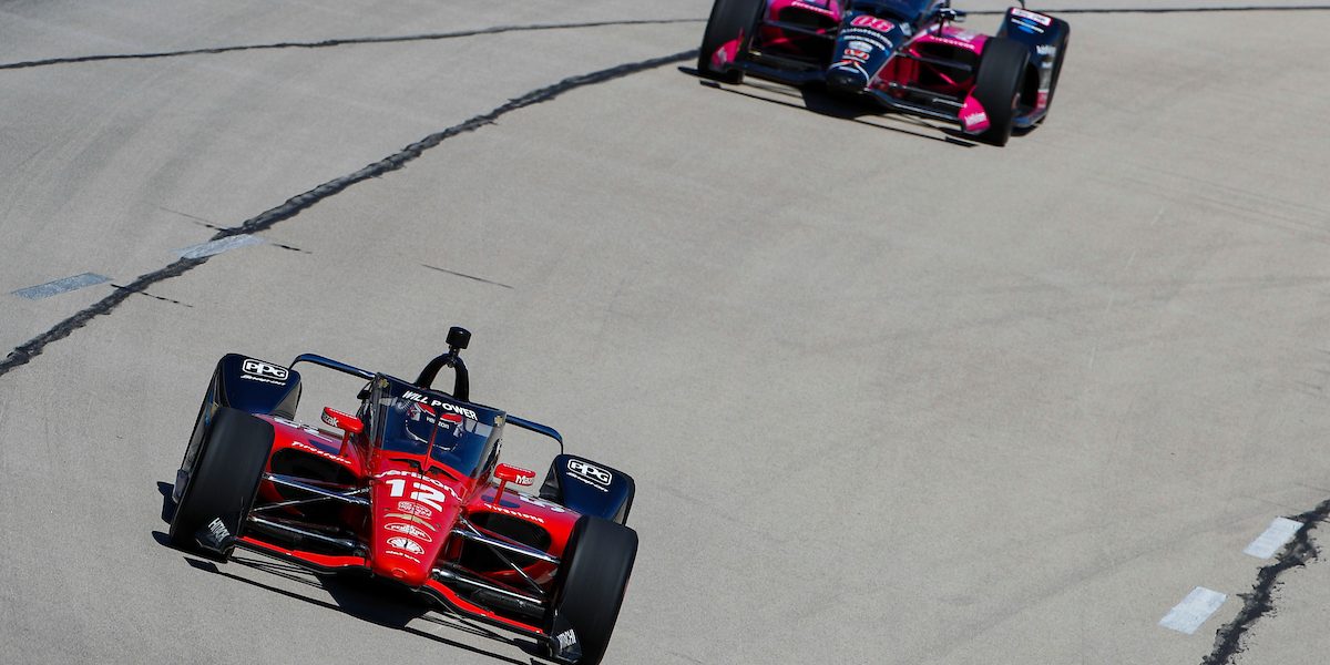 What does a black flag mean in IndyCar racing?